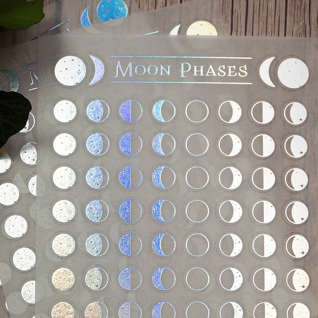 A6 sheet of Moon Phase Washi Stickers featuring 76 small, 8mm holo foil stickers on delicate, semi-transparent washi paper. Designed for journaling, planners, and moon rituals.