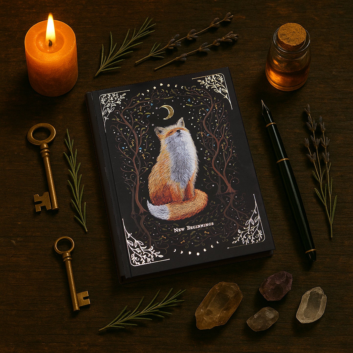 Witchy notebook "New Beginnings" with hand-painted fox illustration, gold foil moon phases and stars on black hardcover, A5 journal with Munken Pure paper.