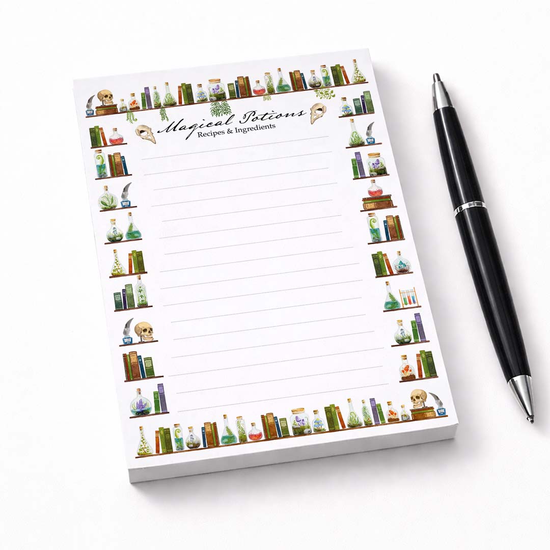 A6 notepad with magical potions illustration on neutral background, paired with a ballpoint pen, clean and modern product setup