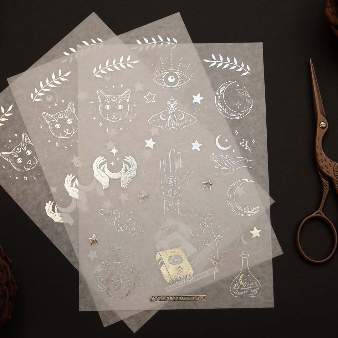 Washi sticker with silver foil print, magical symbols, cats, moths, moon symbols and witchy things