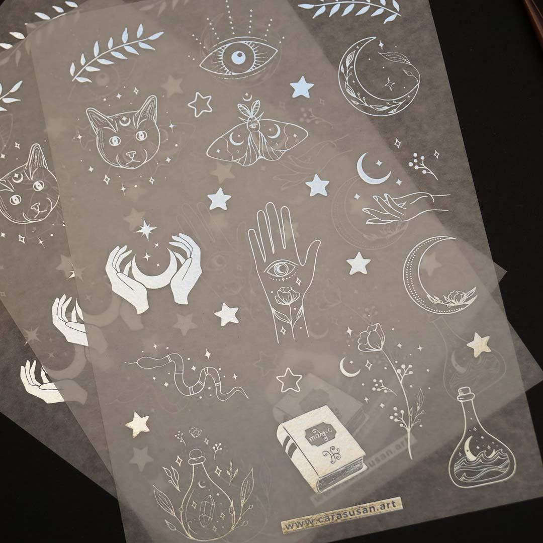Washi sticker with silver foil print, magical symbols, cats, moths, moon symbols and witchy things