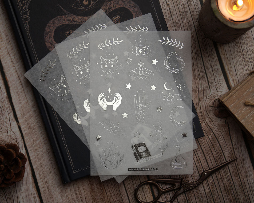 Washi sticker with silver foil print, magical symbols, cats, moths, moon symbols and witchy things