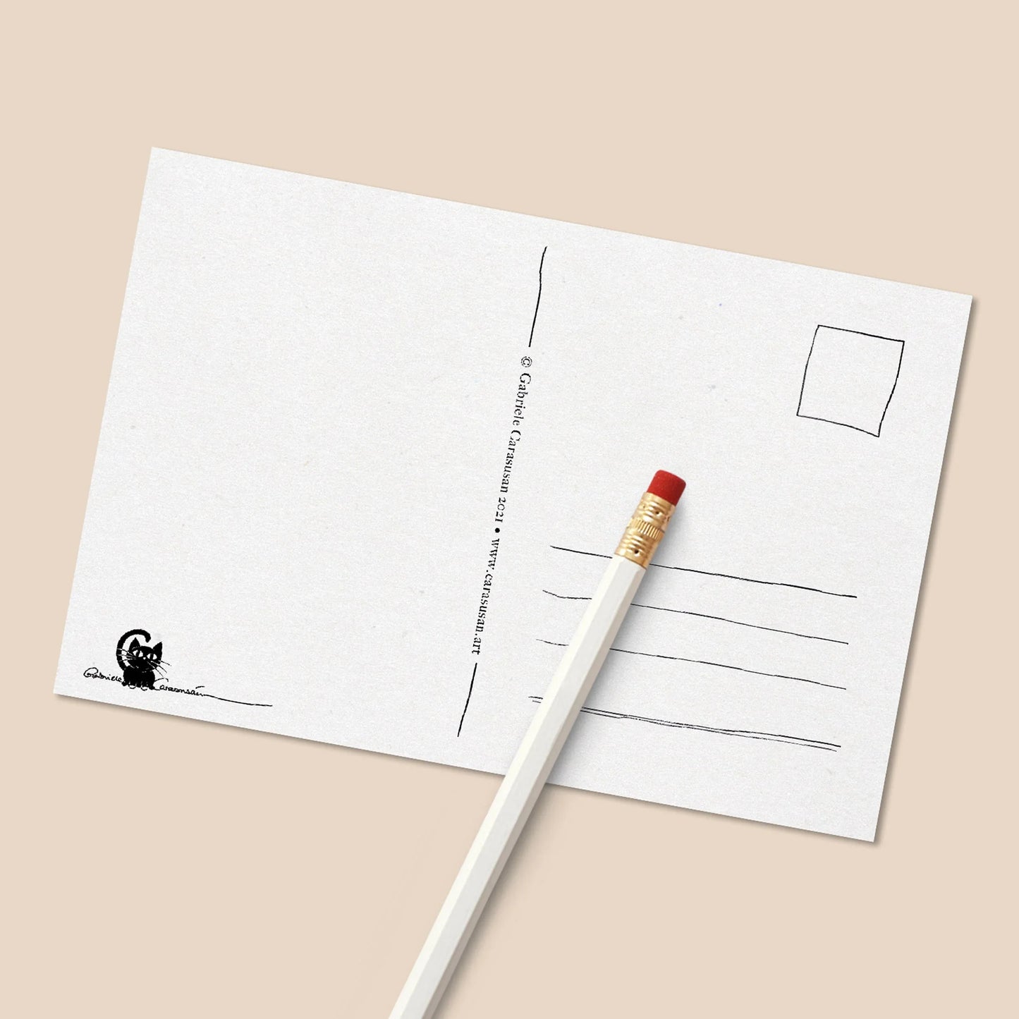 Backside of an illustrated postcard with address lines, space for a stamp and the artist’s small cat logo printed on textured cardstock.