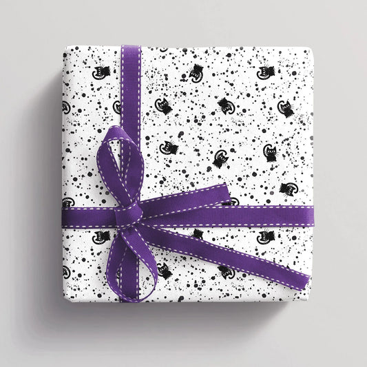 Gift wrapped in black and white cat wrapping paper, minimalist cat design, stylish gift wrap idea for cat lovers