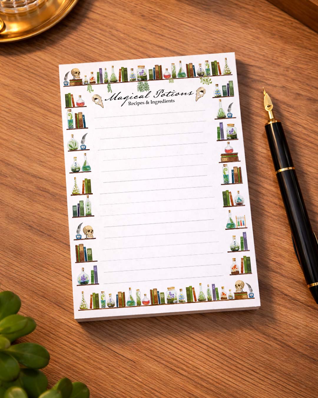 A6 notepad with hand-painted magical potions illustration on a wooden desk, placed next to a fountain pen, soft warm lighting, close perspective