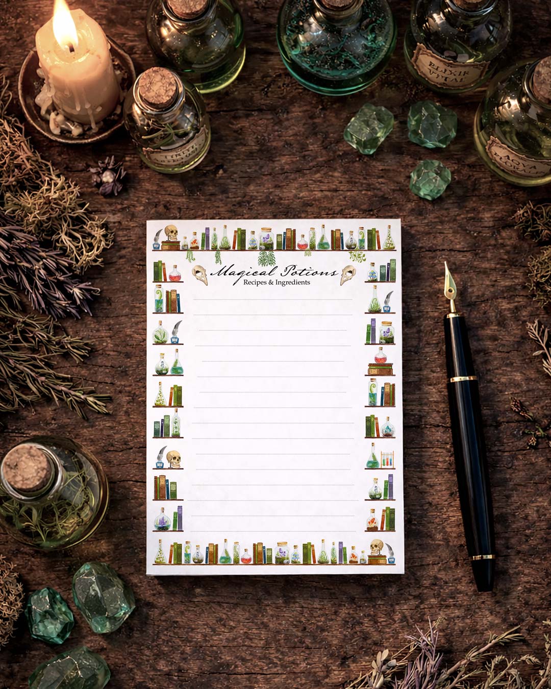 Top view of A6 notepad with magical potions design on wooden table, arranged with fountain pen, apothecary bottles and crystals in a witchy flat lay