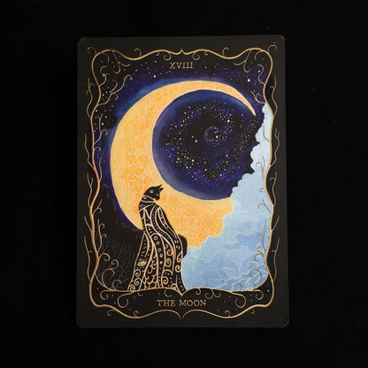 Hand-painted "The Moon" Tarot postcard with gold foil details, featuring a black cat beneath a glowing crescent moon against a black background.