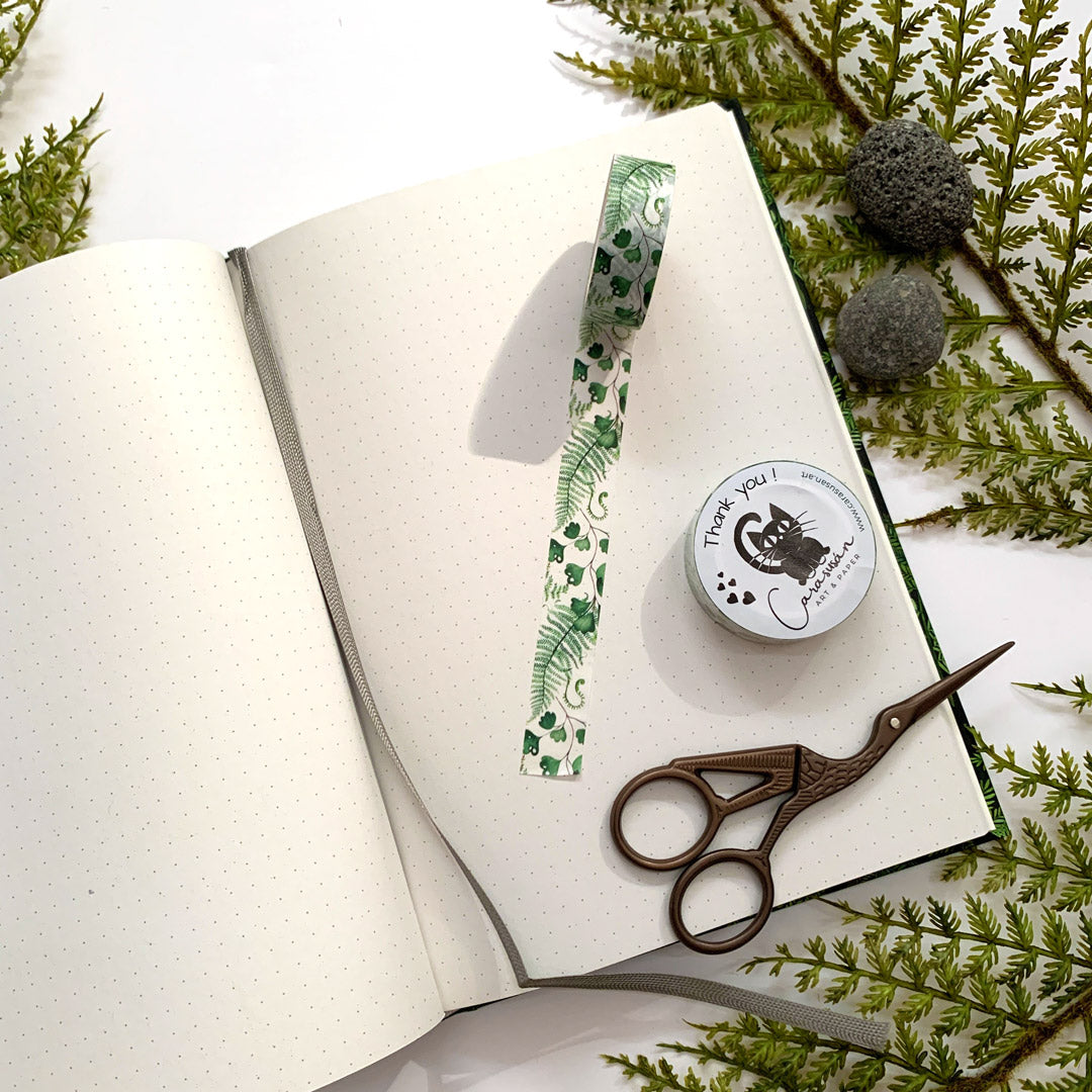Dot grid notebook with bullet journal supplies washi tape fern illustrations