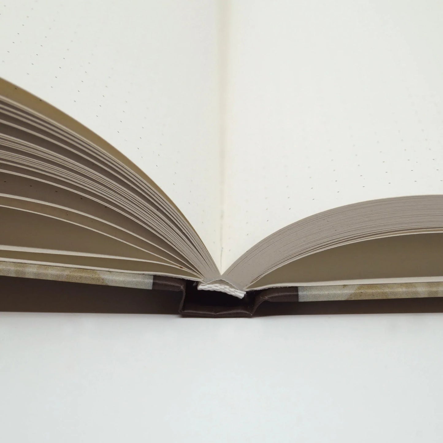 Close-up of the hardcover binding showing the sturdy book construction and textured matte cover finish.